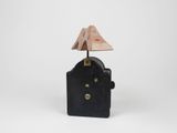 an image of a small clock with a lamp on top of it