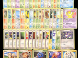 a large collection of pokemon cards on a table