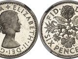 a silver coin with an image of a woman on it