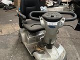 a scooter that is parked in a garage