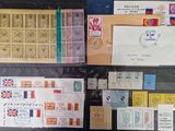 many different types of stamps and envelopes on the table