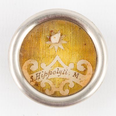 a close up of a button on a white surface