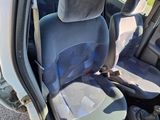 two seats in the back of a van with the door open
