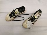adidas superstar shoes with laces on the soles and a tag on the sole
