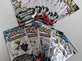 a bunch of pokemon trading cards sitting on top of each other