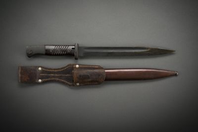 a knife and a knife holder on a table