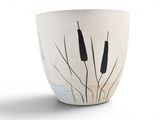 a white vase with a black cattails design on it