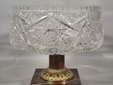 an image of a glass bowl sitting on top of a wooden base