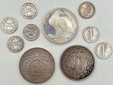 a lot of coins that are on the table