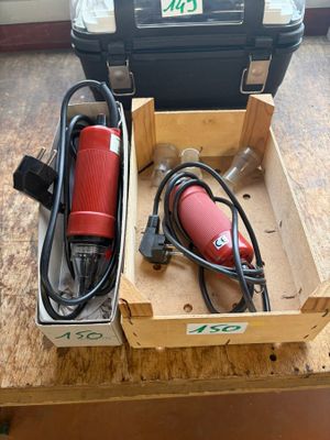 a box with a tool and a cord in it on a table