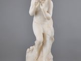 an image of a statue of a woman holding a flower