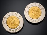 two gold and silver coins sitting on top of each other