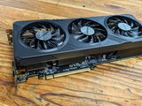 a close up of a video card sitting on top of a wooden table