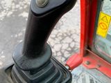 a close up view of a steering control on a tractor