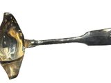 silver plated spoon with a spoon handle and a spoon in the shape of a shell