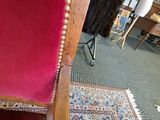 a red chair that is sitting in a room