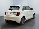 the back of a white fiat car parked in a white room