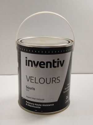 a can of paint sitting on a table with a white background