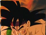 un gros plan sur un tableau représentant un jeune Gohan avec du sang sur le visage