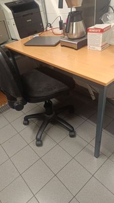 a desk with a computer and a printer on it