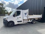 a white truck that is parked in front of a building