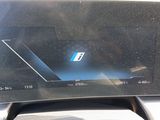 a picture of a car dashboard with a bmw logo on it