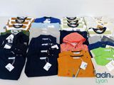 a lot of men ' s clothing on display on a table