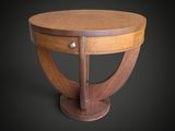 une table en bois avec un plateau rond et un piètement en bois