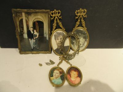 a necklace with a picture of a woman and a picture of a man