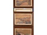 three framed paintings of a farm scene with a barn in the distance