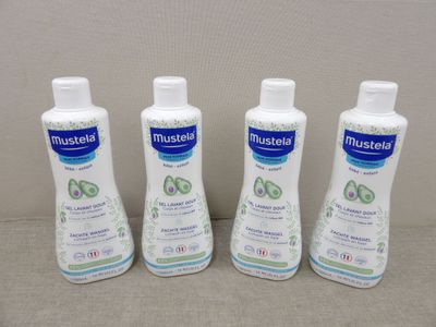 three bottles of moist lotion sitting on a table next to each other