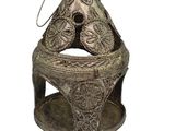 a silver statue of a bear on a pedestal