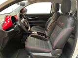 the interior of a small car with two seats and a steering wheel