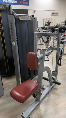 a gym equipment in a gym room with a lot of machines