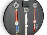 a picture of a clock with a bunch of watches on it