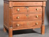 an old wooden chest of drawers with brass pulls and handles