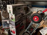 many boxes and a hand truck in a warehouse
