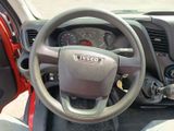 dashboard of a vehicle with a steering wheel and dashboard controls