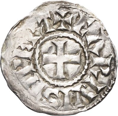 une pièce d'argent sur laquelle figure une croix au centre