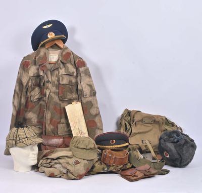 a uniform and hat on display on a white background
