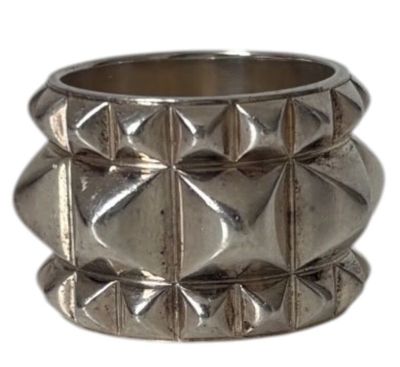 a close up of a silver ring on a white background