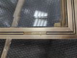 a close up of a window with a metal frame