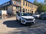 a white suv parked in front of a building