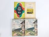 three books sitting on top of each other on a table