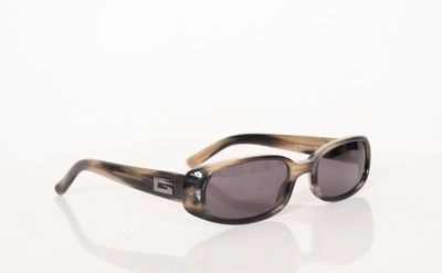 sunglasses on a white surface with a white background