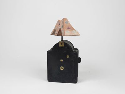 an image of a small clock with a lamp on top of it