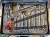 a tool case with tools in it sitting on a table