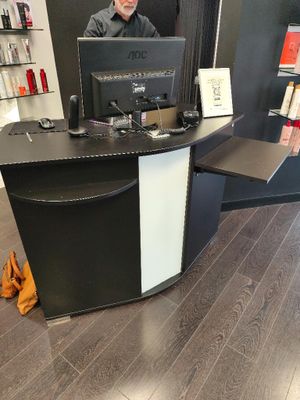 a man that is sitting at a desk with a computer