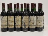 six bottles of wine are lined up in a row