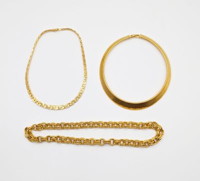 a collection of gold jewellery including a necklace, bracelet and ring
